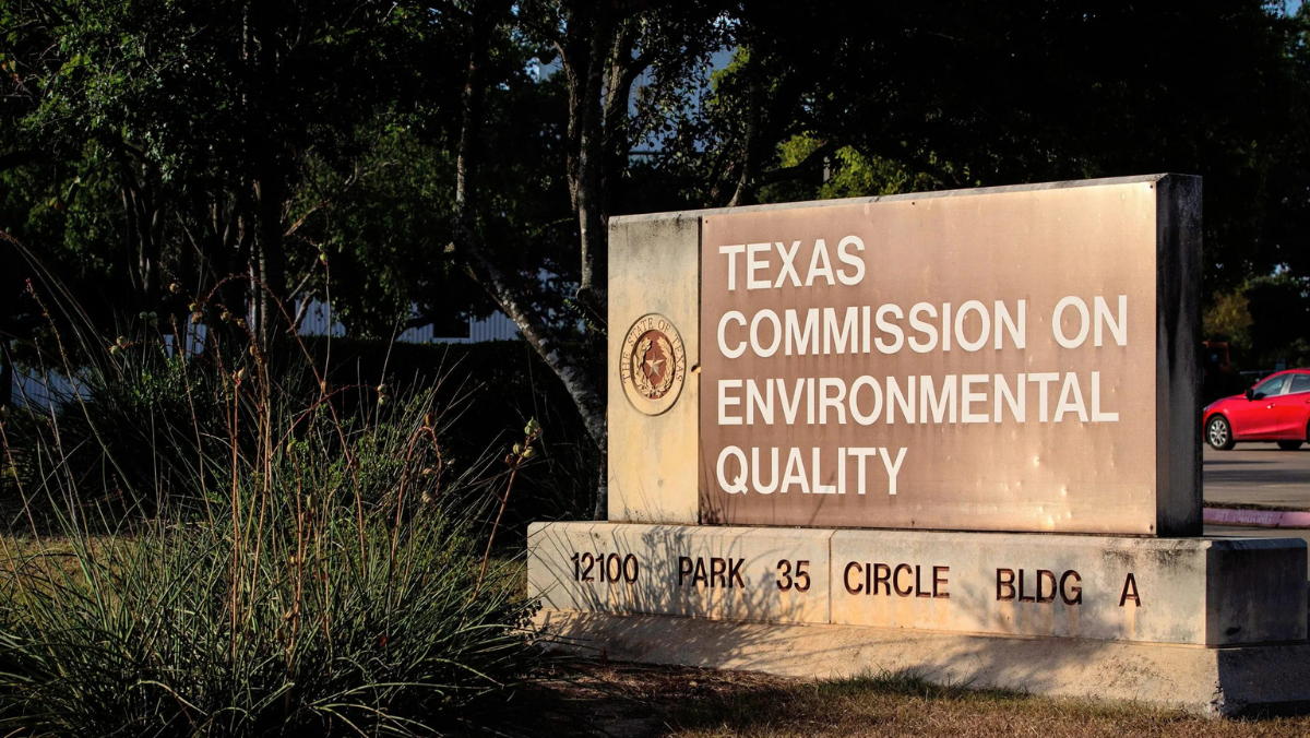Texas Commission on Environmental Quality sign outside headquarters indicating regulatory role.