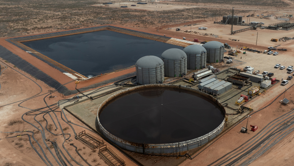 Aerial view of Permian Basin water treatment and storage facilities showing large tanks, ponds and pipelines.