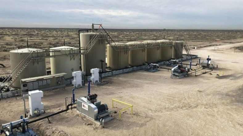 Onshore oilfield facility with storage tanks, pumps and pipeline equipment
