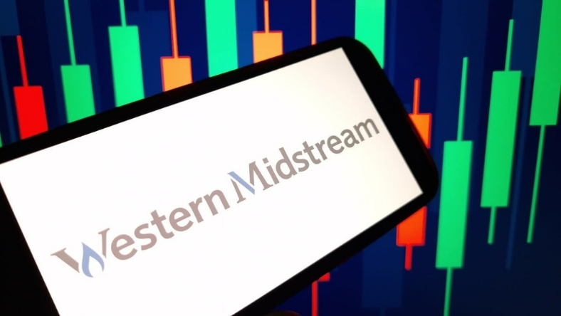 Western Midstream logo on smartphone with financial chart background