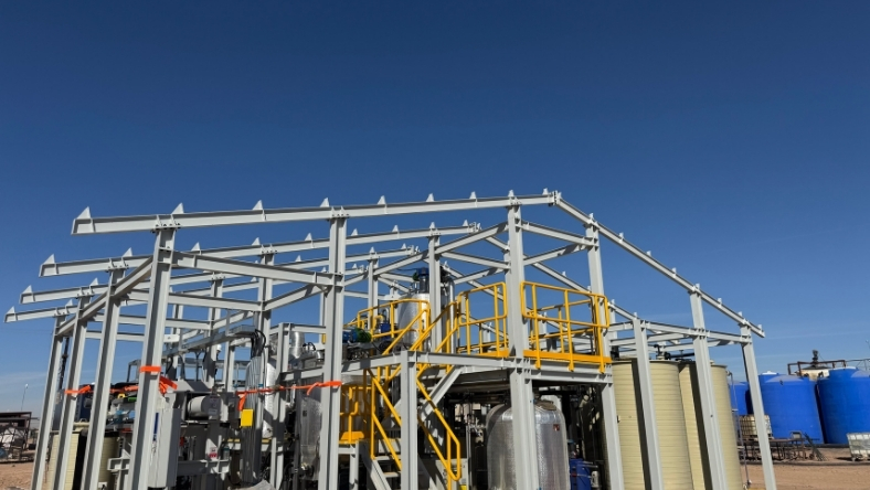 Industrial processing structure with tanks and platforms at energy site